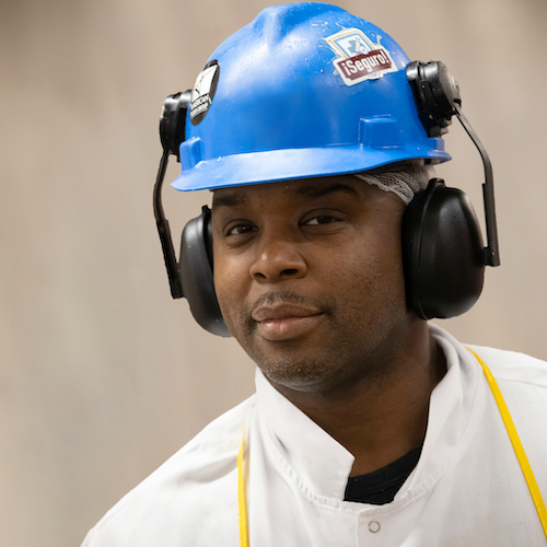 man in hard hat and ear protection