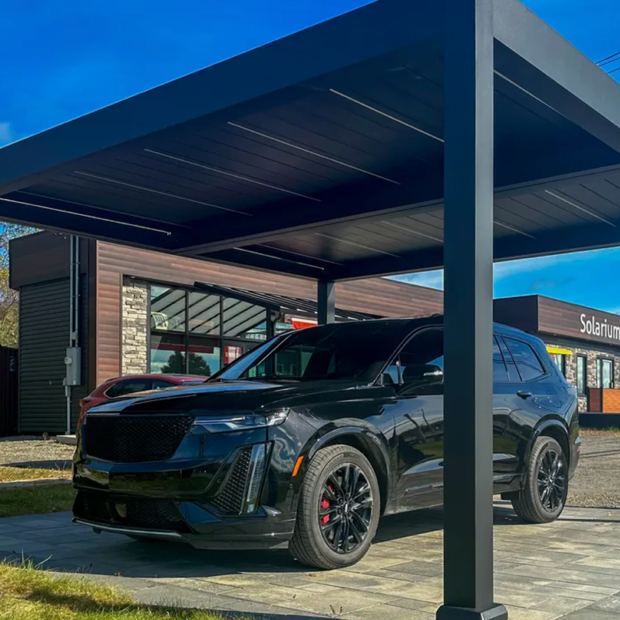 Car under a carport at a store