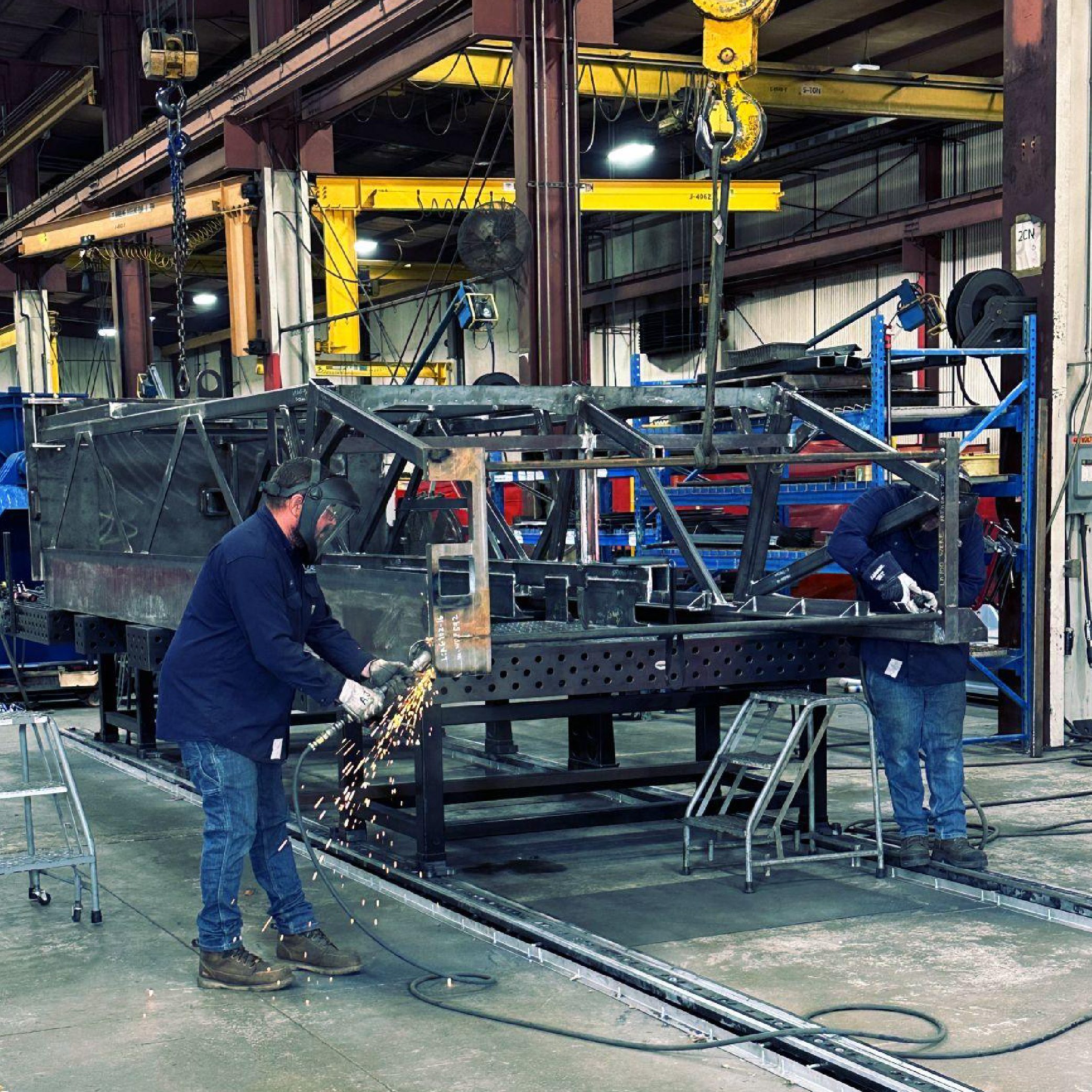 Van-Am workers welding on equipment
