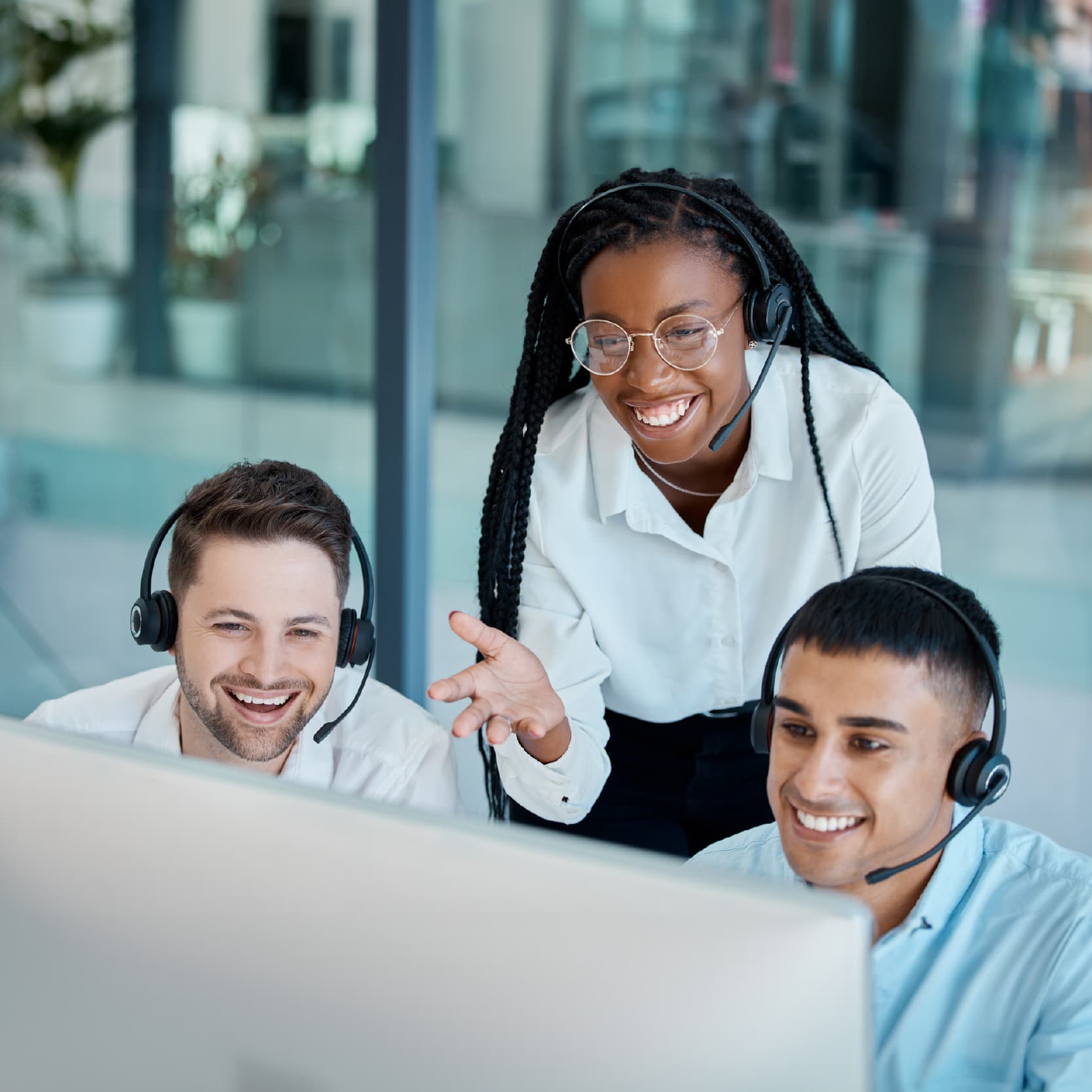 Group of Americo employees on computer
