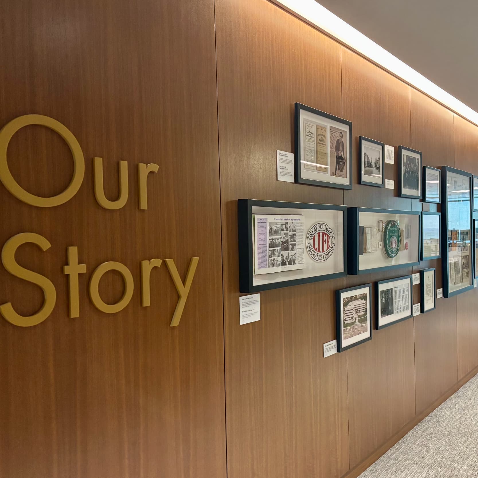 Wall of Americo building reading "our story" with history of company