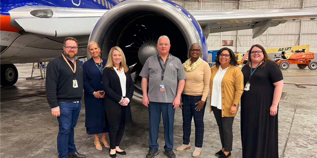 Image of Missouri One Start and Metropolitan Community College with Aviation Tech Services workers.